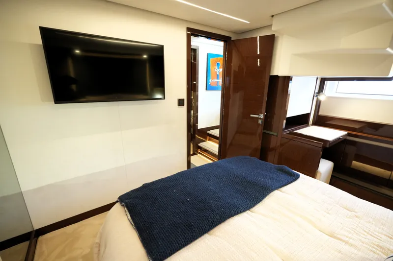 Slide: The Image of Luxurious interior of 2023 Prestige 690 yacht with modern bedroom and flat-screen TV. - 108