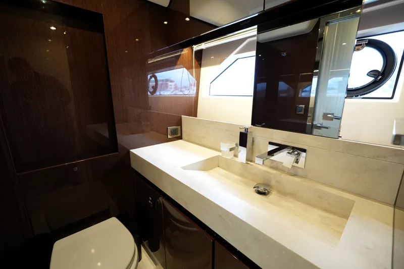 Slide: The Image of Luxurious bathroom interior of 2023 Prestige 690 yacht, featuring sleek design and modern fixtures. - 112