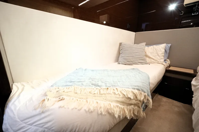 Slide: The Image of Luxurious 2023 Prestige 690 yacht cabin with cozy bedding and elegant decor. - 114