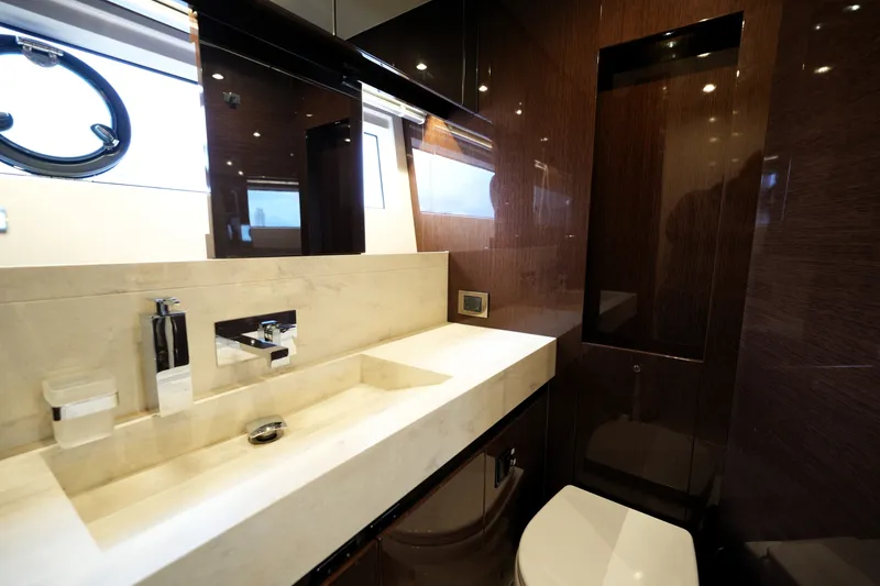 Slide: The Image of Luxurious bathroom interior of 2023 Prestige 690 yacht, featuring sleek design and modern fixtures. - 123