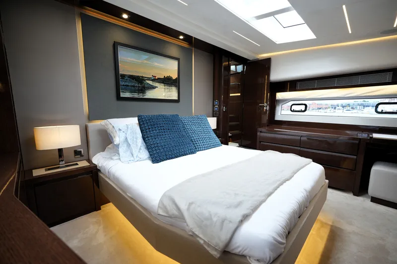 Slide: The Image of Luxurious bedroom interior of 2023 Prestige 690 yacht, featuring elegant decor and modern amenities. - 89