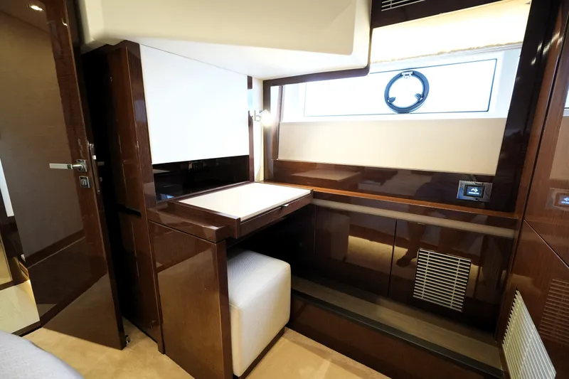 Slide: The Image of Luxurious interior of 2023 Prestige 690 yacht with elegant wood finish and modern design. - 109