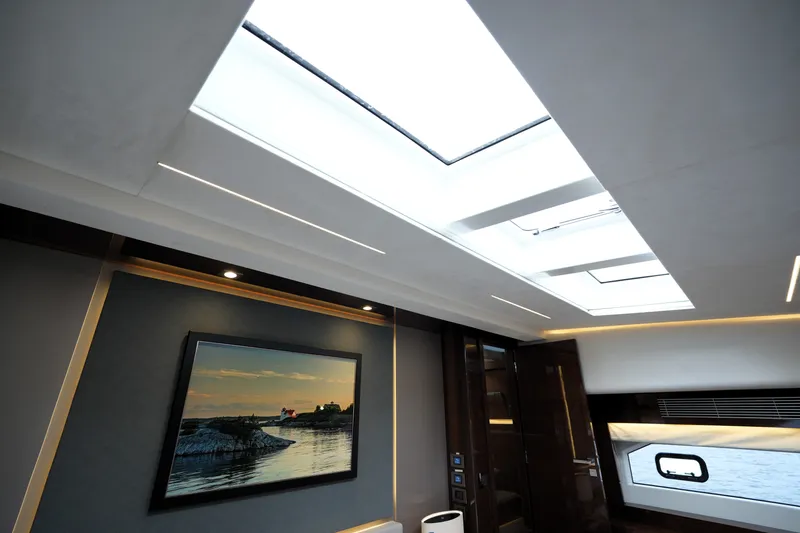 Slide: The Image of Luxurious interior of 2023 Prestige 690 yacht with skylights and elegant decor. - 92