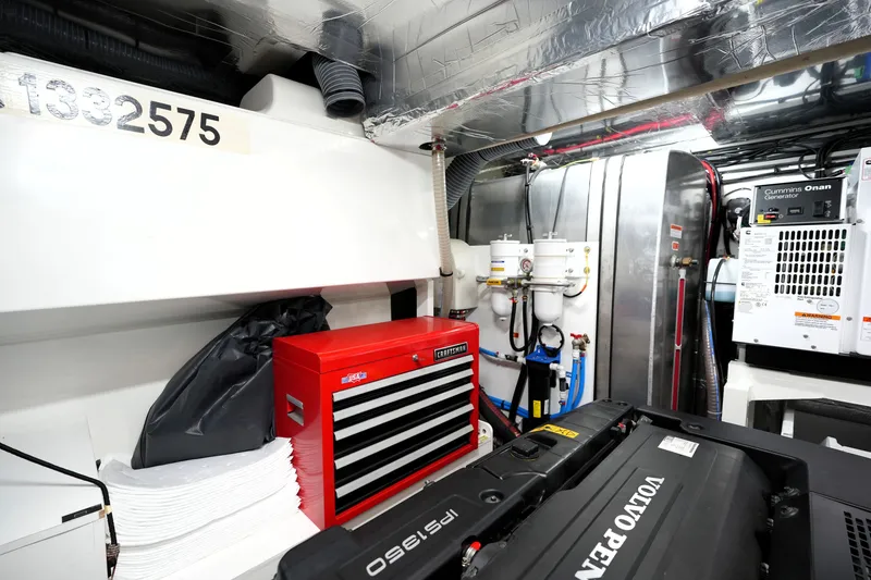 Slide: The Image of Engine room of 2023 Prestige 690 yacht with Volvo Penta engine and Cummins Onan generator. - 127