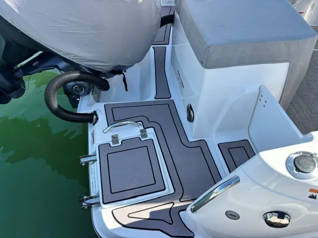 Slide: The Image of The image shows the stern of a 2026 Cutwater C-248 Coupe with gray cushions and an outboard motor. - 24