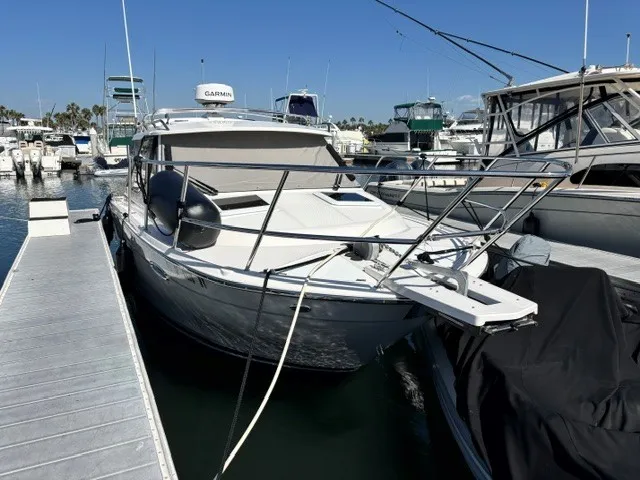 Slide: The Image of A modern 2026 Cutwater C-248 Coupe docked at a sunny marina. - 30