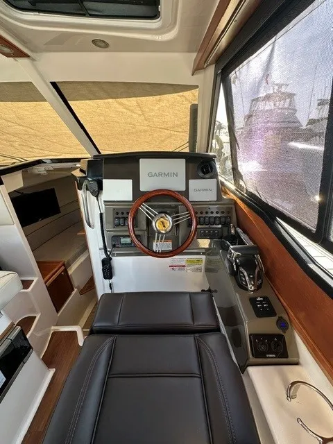 Slide: The Image of The cockpit of the 2026 Cutwater C-248 Coupe features a modern helm with Garmin technology. - 44