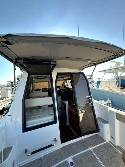 Slide: The Image of The 2026 Cutwater C-248 Coupe features a modern design with a covered cockpit and comfortable seating. - 39