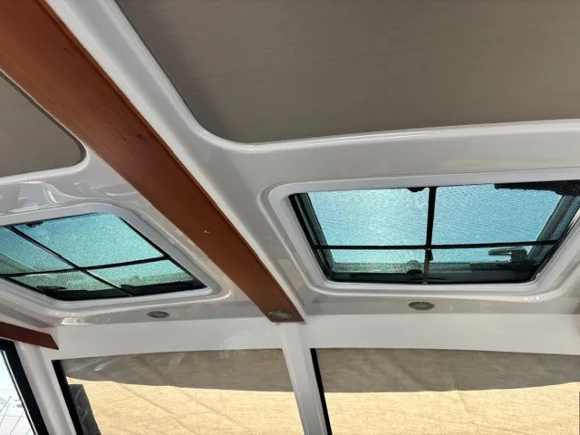 Slide: The Image of The image shows the roof of a Cutwater C-248 Coupe with two large windows. - 49
