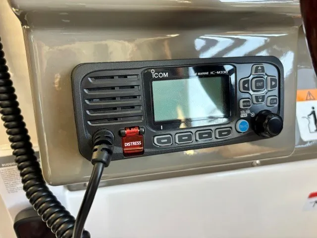 Slide: The Image of An ICOM marine radio is installed in a boat's dashboard. - 34