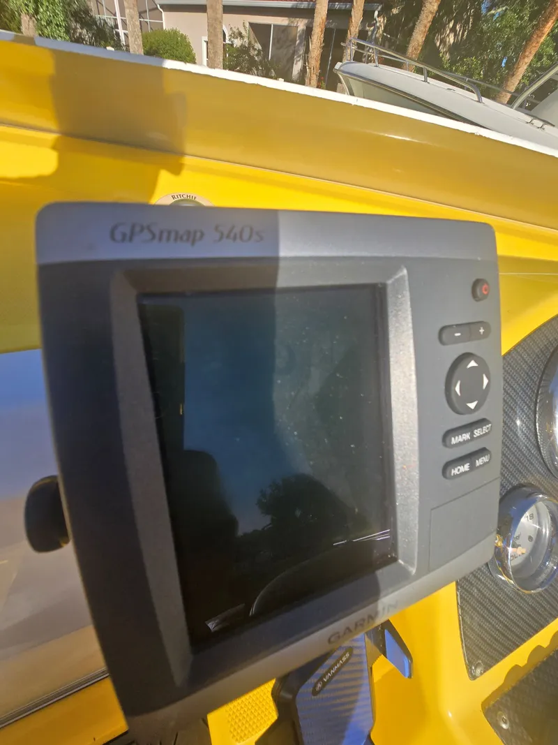 Slide: The Image of A GPSmap 540s navigation device is mounted on a yellow boat. - 12
