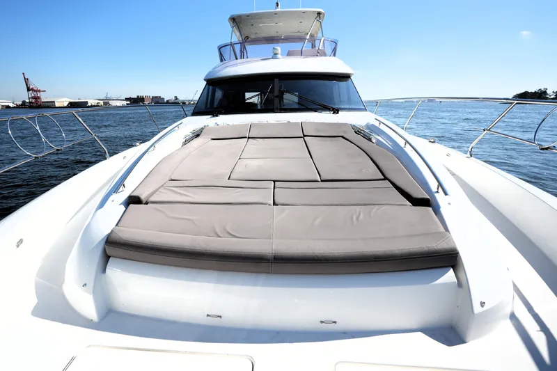 Slide: The Image of 2016 Prestige 550 yacht with sunbathing deck on calm waters. - 21