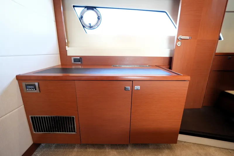 Slide: The Image of Interior of 2016 Prestige 550 yacht with wooden cabinetry and modern design. - 79