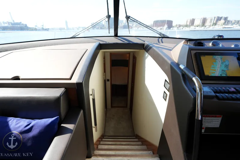 Slide: The Image of Interior view of 2016 Prestige 550 yacht cockpit with navigation screen and stairs. - 87