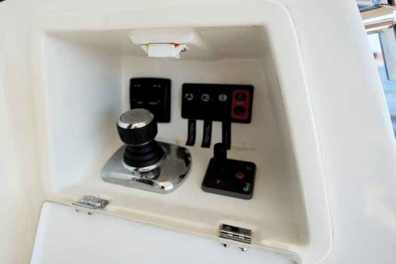Slide: The Image of Control panel of a 2016 Prestige 550 yacht, featuring joystick and switches. - 19