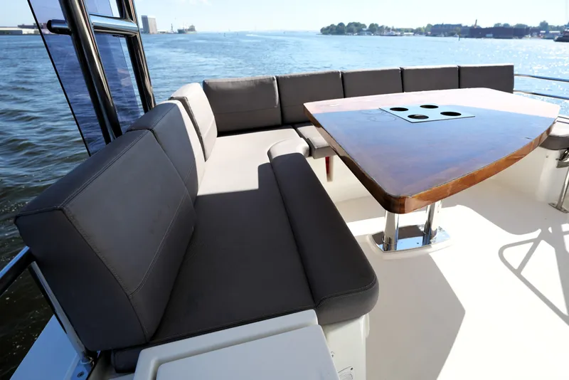 Slide: The Image of Luxurious seating area on a 2016 Prestige 550 yacht with ocean view. - 28