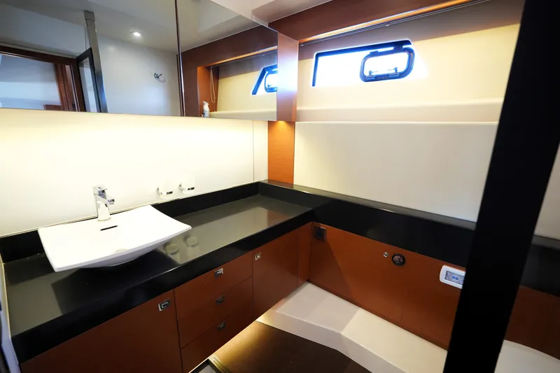 Slide: The Image of Luxurious bathroom interior of a 2016 Prestige 550 yacht, featuring modern fixtures and sleek design. - 85