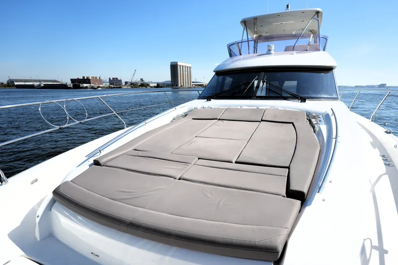 Slide: The Image of Luxury 2016 Prestige 550 yacht with sunbathing deck, docked by the waterfront. - 22