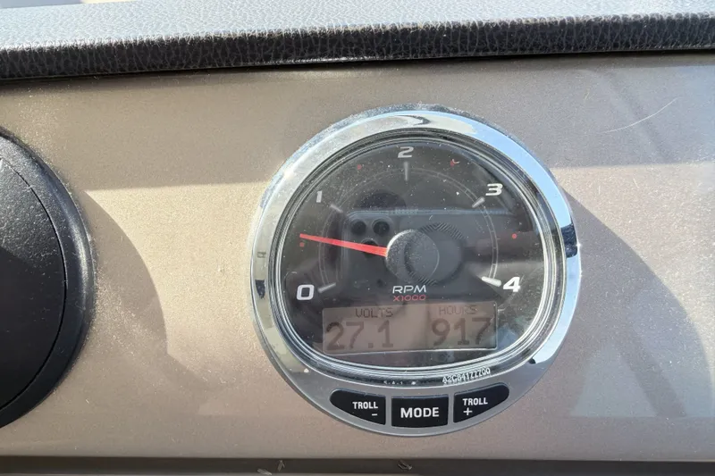 Slide: The Image of Dashboard of a 2016 Prestige 550 showing RPM gauge and digital display. - 71