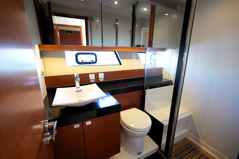 Slide: The Image of Luxurious bathroom interior of a 2016 Prestige 550 yacht, featuring modern fixtures and elegant design. - 94