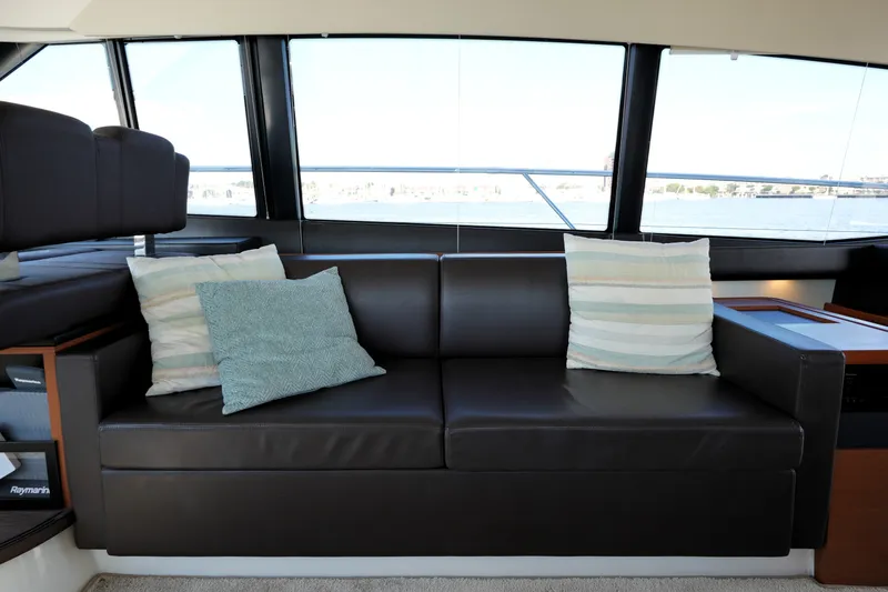 Slide: The Image of Luxurious interior of 2016 Prestige 550 yacht with leather sofa and decorative pillows. - 57