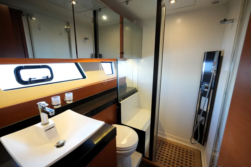 Slide: The Image of Luxurious bathroom interior of 2016 Prestige 550 yacht, featuring modern sink and shower. - 93