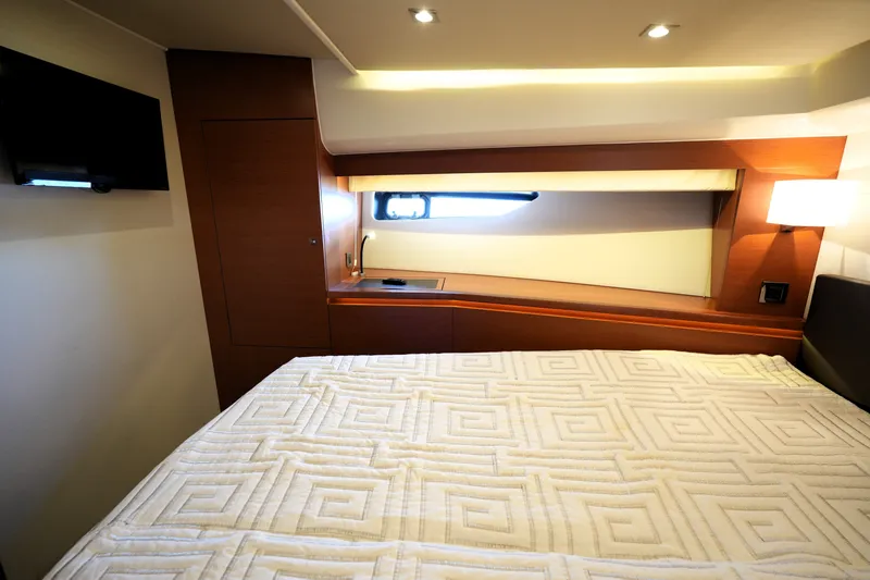 Slide: The Image of Luxurious cabin interior of 2016 Prestige 550 yacht with bed and window view. - 91
