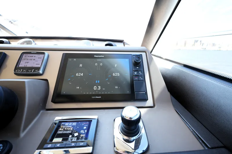 Slide: The Image of Control panel of a 2016 Prestige 550 yacht with navigation displays. - 68