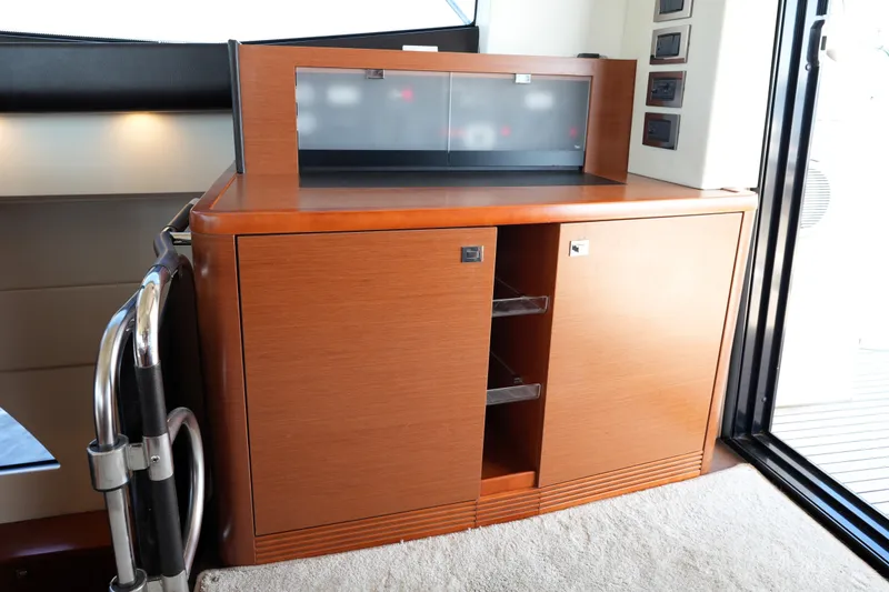 Slide: The Image of Wooden cabinet with sliding doors inside a 2016 Prestige 550 yacht interior. - 43