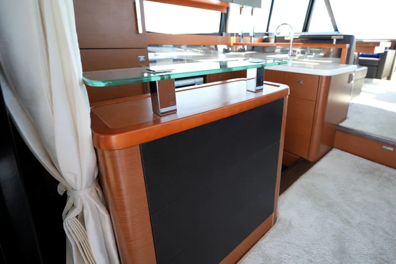 Slide: The Image of Luxurious interior of 2016 Prestige 550 yacht with modern cabinetry and glass accents. - 48