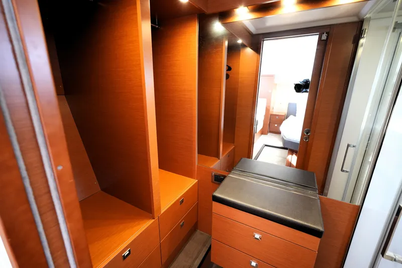 Slide: The Image of Luxurious wooden interior of 2016 Prestige 550 yacht with ample storage space. - 82