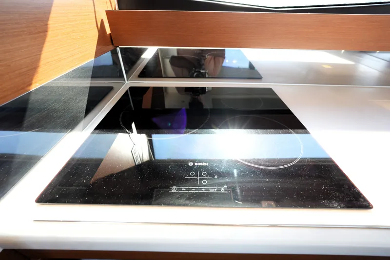 Slide: The Image of Modern kitchen with Bosch induction cooktop on Prestige 550 yacht, 2016 model. - 50