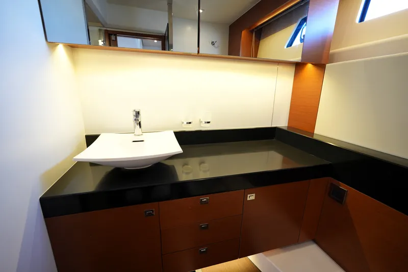 Slide: The Image of Luxurious bathroom interior of 2016 Prestige 550 yacht with modern sink and sleek design. - 86