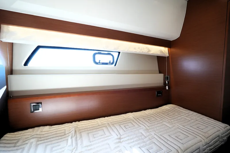 Slide: The Image of Luxurious cabin interior of 2016 Prestige 550 yacht with cozy bedding and modern design. - 96