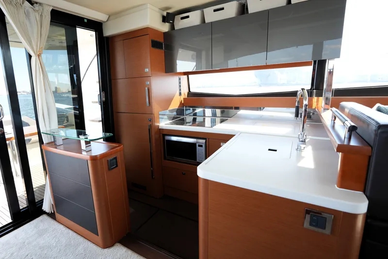 Slide: The Image of Luxurious kitchen interior of a 2016 Prestige 550 yacht with modern amenities. - 47
