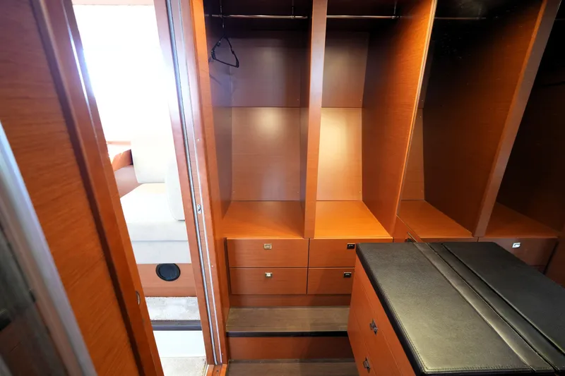 Slide: The Image of Luxurious wooden closet interior on a 2016 Prestige 550 yacht. - 83