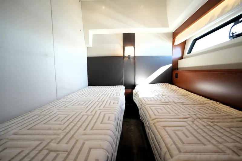Slide: The Image of Luxurious twin cabin interior of 2016 Prestige 550 yacht with modern design elements. - 98