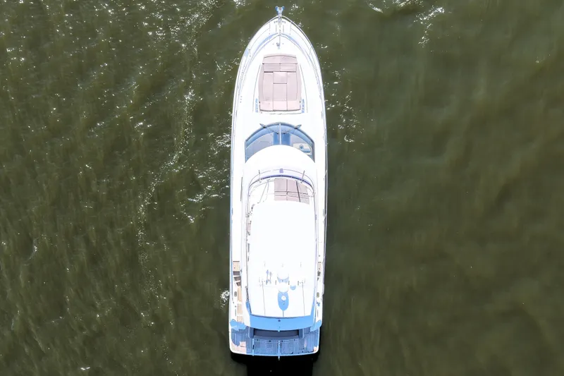 Slide: The Image of Aerial view of 2016 Prestige 550 yacht cruising on open water. - 6