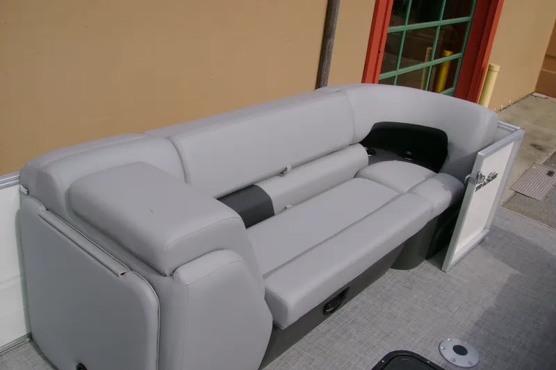 Slide: The Image of 2026 Sun Tracker Party Barge 24 XP3, featuring comfortable gray seating. - 15