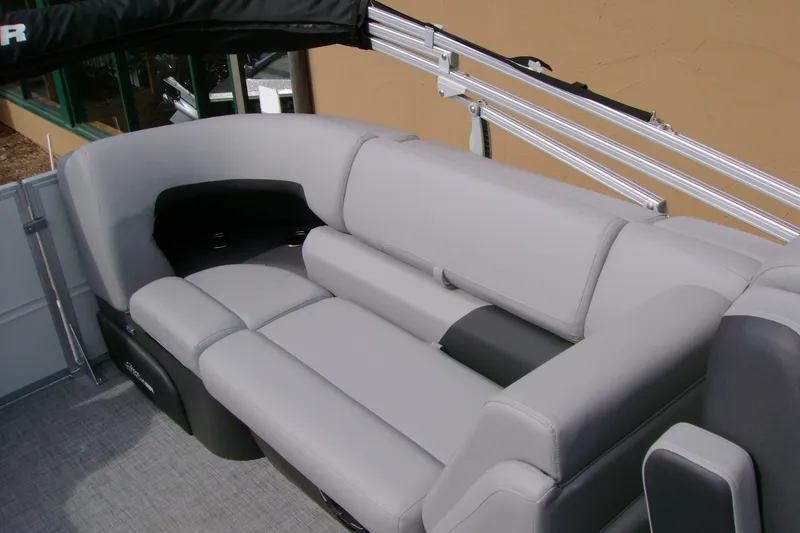 Slide: The Image of 2026 Sun Tracker Party Barge 24 XP3 interior with plush gray seating and sleek design. - 16