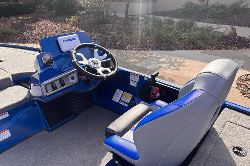 Slide: The Image of 2027 Nitro Z18 XL boat cockpit with steering wheel and Lowrance display. - 7