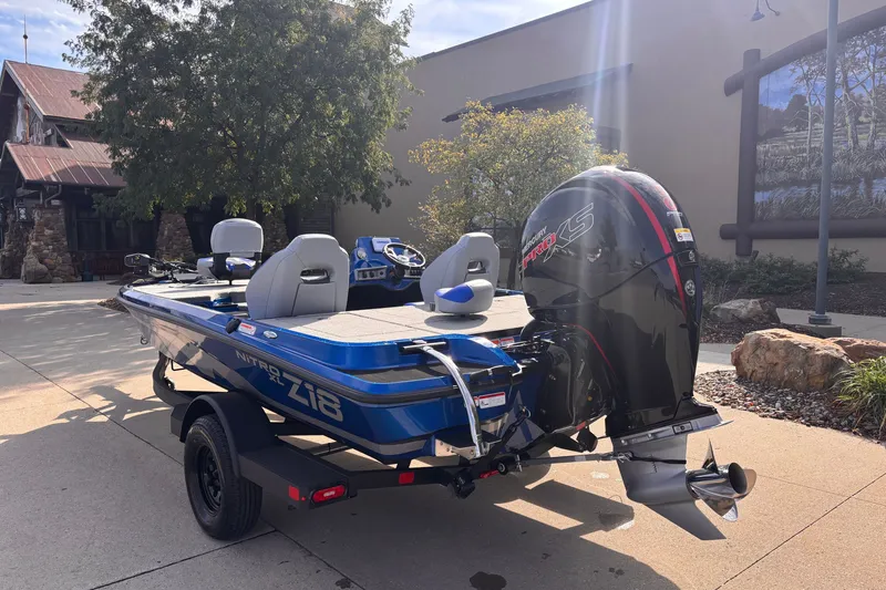 Slide: The Image of 2027 Nitro Z18 XL boat with Mercury Pro XS engine, parked outdoors. - 3