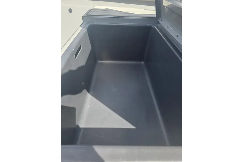 Slide: The Image of Storage compartment of 2027 Tracker Bass Tracker 175 CC boat, featuring spacious interior design. - 16