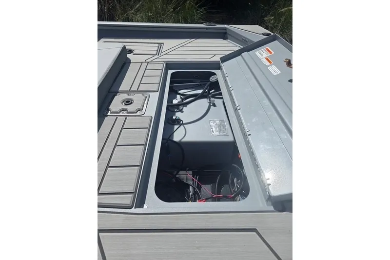 Slide: The Image of 2027 Tracker Bass Tracker 175 CC boat interior with open storage compartment. - 15