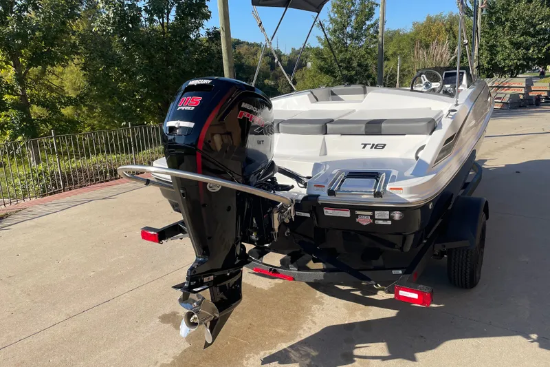 Slide: The Image of 2027 Tahoe T18 boat with Mercury 115 Pro XS engine on a trailer. - 2
