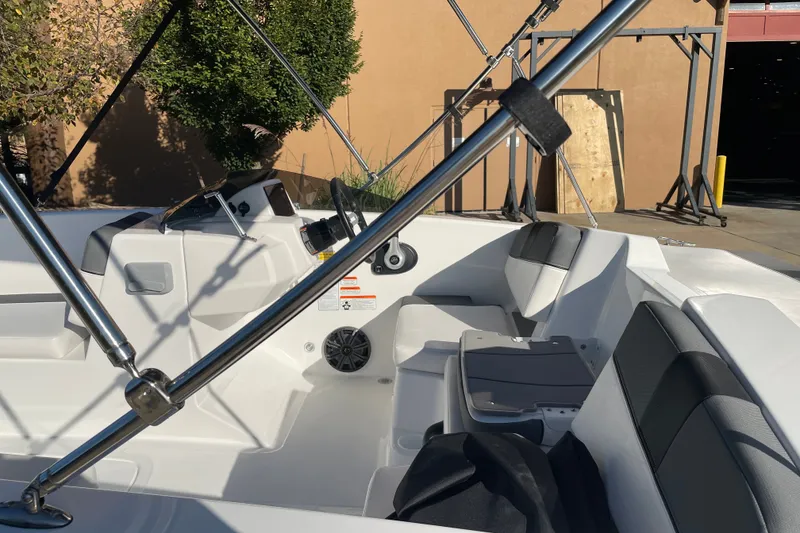 Slide: The Image of 2027 Tahoe T18 boat interior with seating and steering wheel, showcasing modern design. - 5