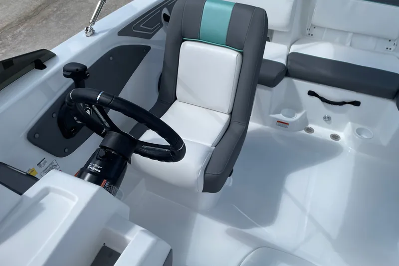 Slide: The Image of Interior of 2027 Tahoe T21 boat with steering wheel and seating. - 13