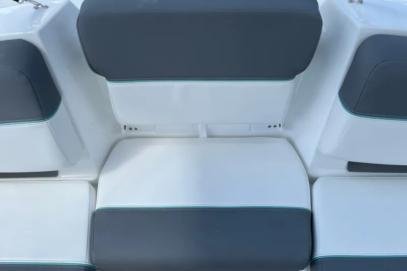 Slide: The Image of 2027 Tahoe T21 boat seating with gray and white upholstery, featuring teal accents. - 15