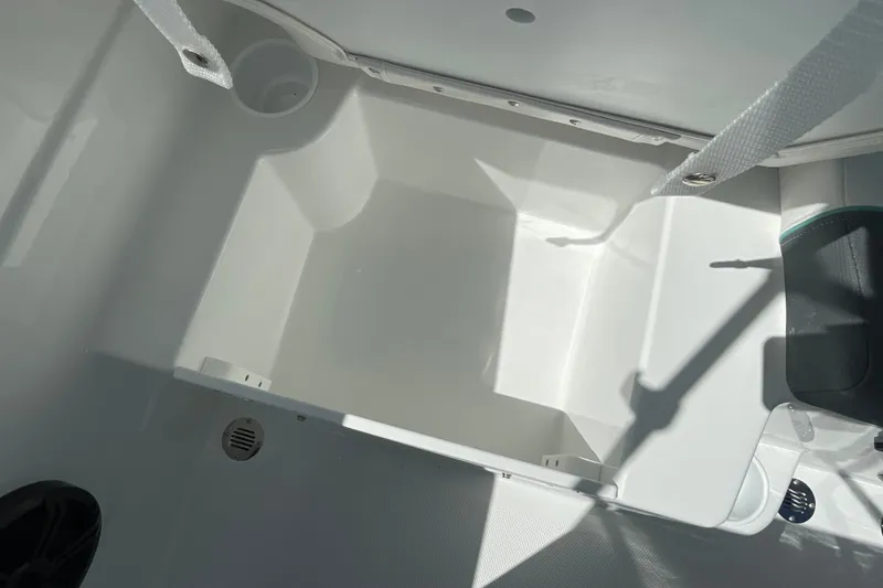 Slide: The Image of Interior view of 2027 Tahoe T21 boat compartment with white finish and drainage feature. - 21