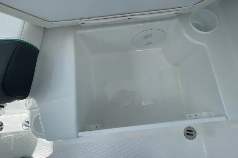 Slide: The Image of Spacious storage compartment in 2027 Tahoe T21 boat interior. - 26